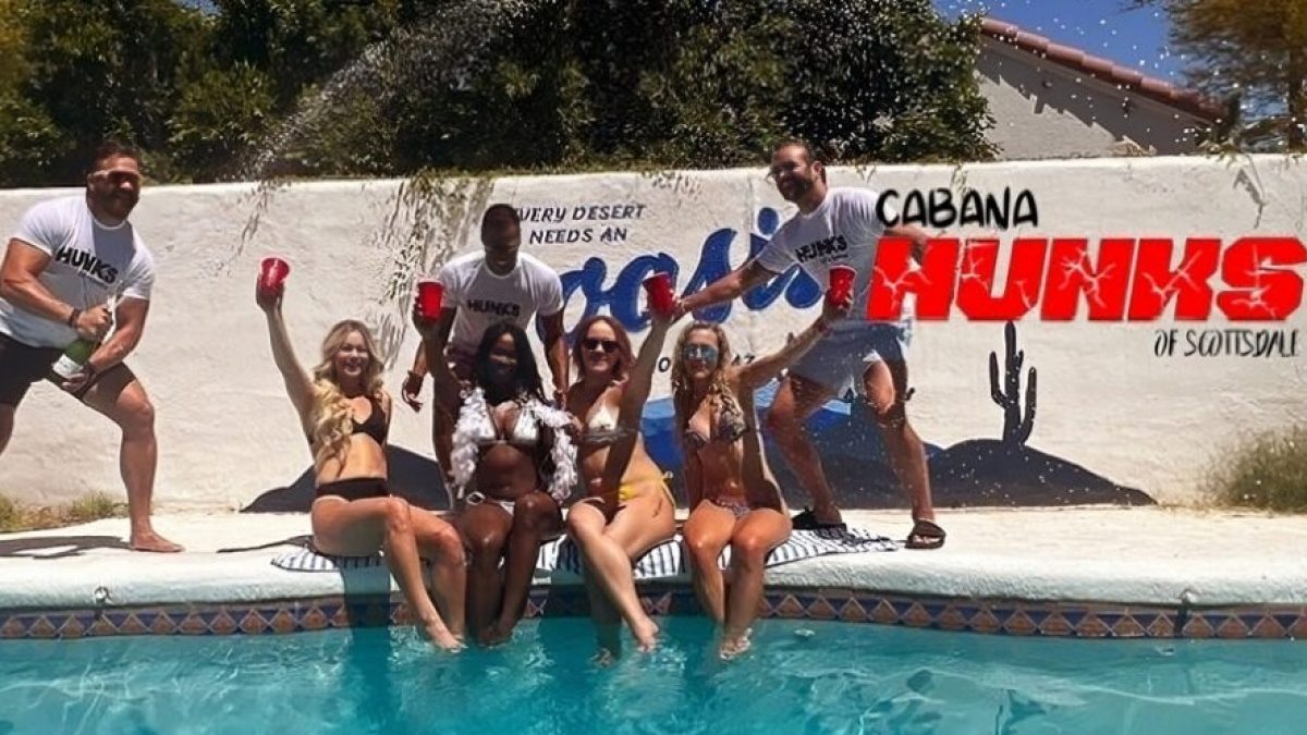 a group of people in a pool of water