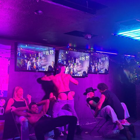 a group of people sitting on a stage