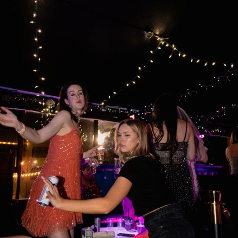 a group of people playing instruments and performing on a stage